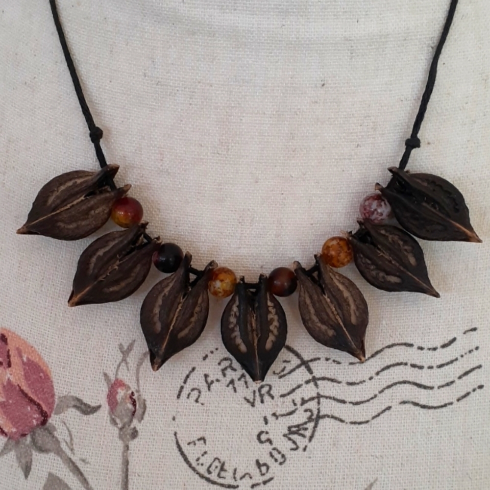 ^ Vintage Devil's Claw and bead amulet necklace